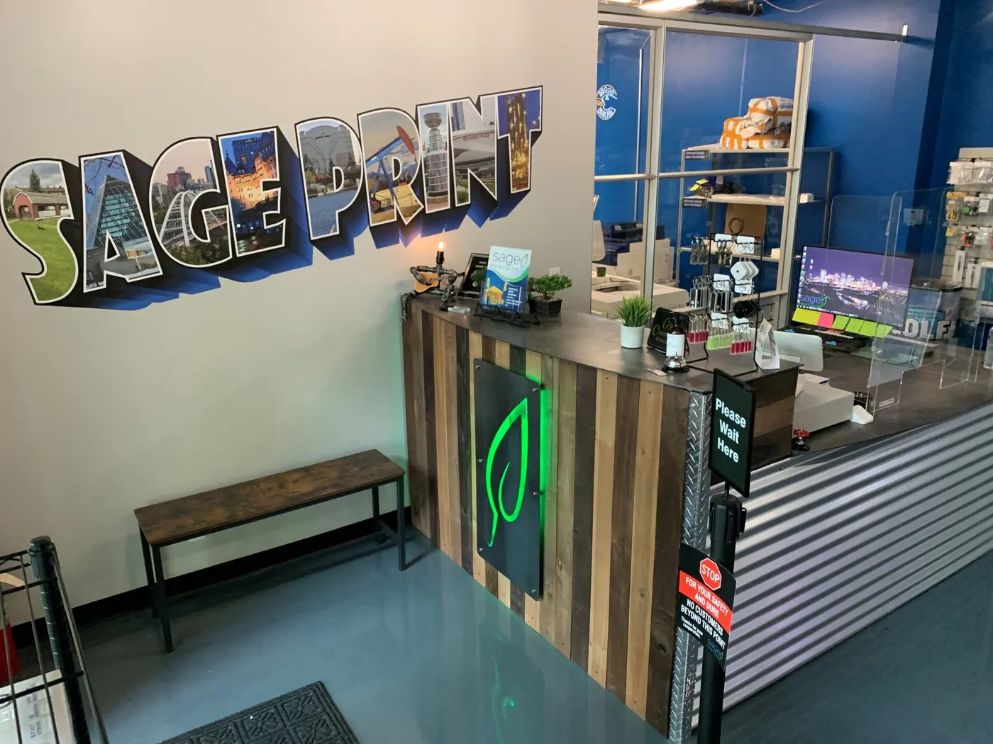 Sage Print front counter and SAGE PRINT mural wall