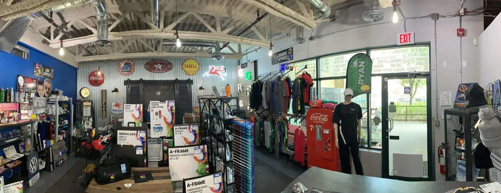 Shop floor with apparel, displays, and entrance